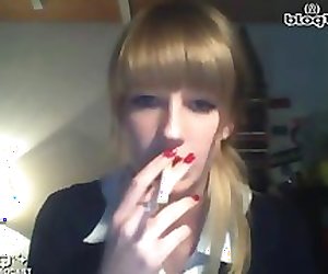 young school girl smoking a cigarette on cam