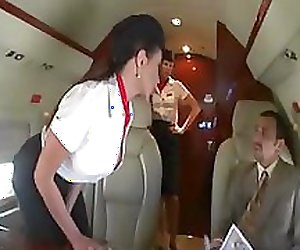 Beautiful stewardess is fucking with two businessmen on the board of a plane