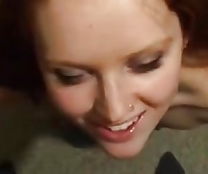 Redhead sucks and jerks cock to give herself a facial