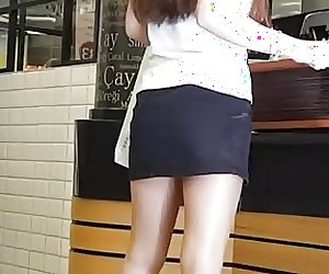 Pantyhose Saleswoman in Shiny Tan Pantyhose